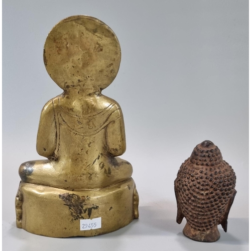 141 - Cast yellow metal Buddha with a halo of enlightenment behind the head, seated in Padmasana, on a pli... 