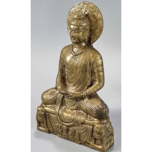 141 - Cast yellow metal Buddha with a halo of enlightenment behind the head, seated in Padmasana, on a pli... 