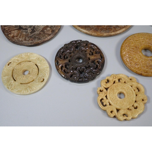 142 - Collection of ten Chinese carved hardstone 'Bi' discs of varying designs including; repeating dragon... 