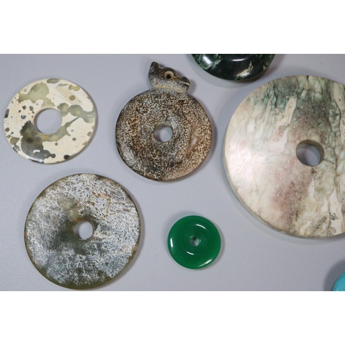 143 - A collection of unusual Chinese 'Bi' discs to include varying designs and hardstones including; mala... 