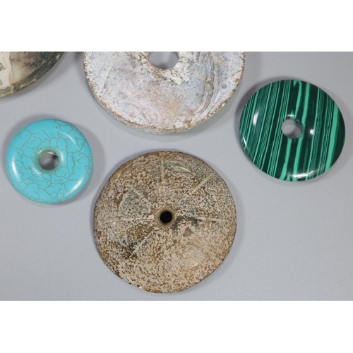 143 - A collection of unusual Chinese 'Bi' discs to include varying designs and hardstones including; mala... 