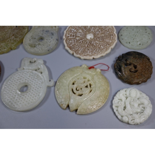 144 - A collection of Chinese carved hardstone 'Bi' discs, varying designs including; character marks and ... 