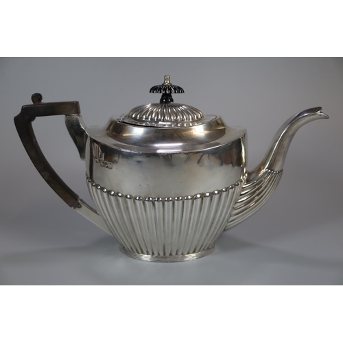 148 - Georgian style silver four piece tea/coffee service with fluted design and ebonised handle and finia... 