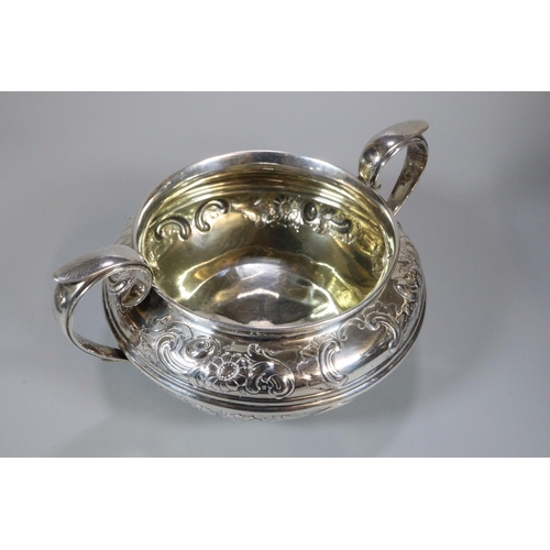 149 - Early 19th century silver baluster shaped teapot with turned wooden handle, engraved armorial and fl... 