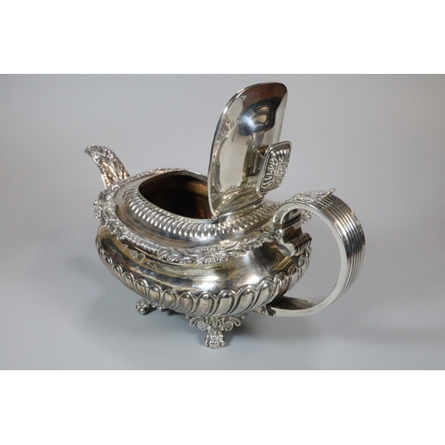 150 - 19th century silver ornate teapot with raised leaf and acanthus decoration, engraved armorials above... 