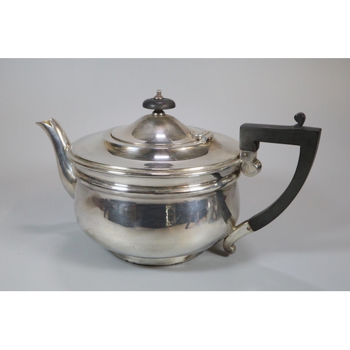 151 - George V silver three piece tea service comprising; two handled sucrier, cream jug and teapot with e... 