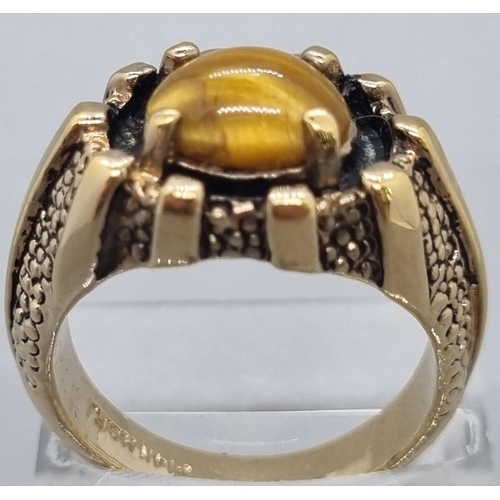 163 - 14ct gold ring inset with tiger's eye cabochon stone, ring size S. Weight 10.4g approx.
(B.P. 21% + ... 