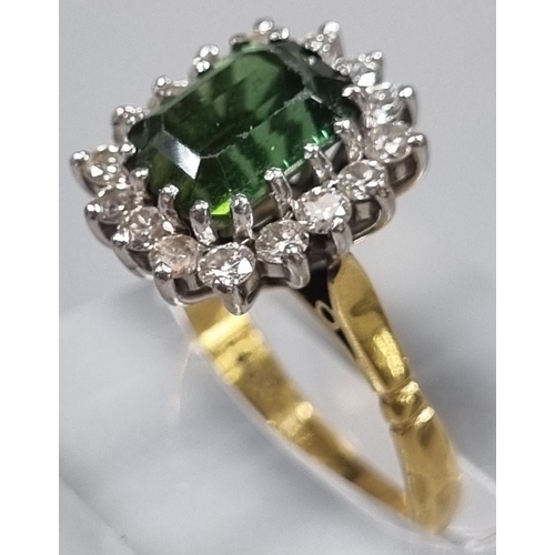 165 - 18ct gold diamond seventeen stone ring inset with central faceted green stone. 4.8g approx. Ring siz... 