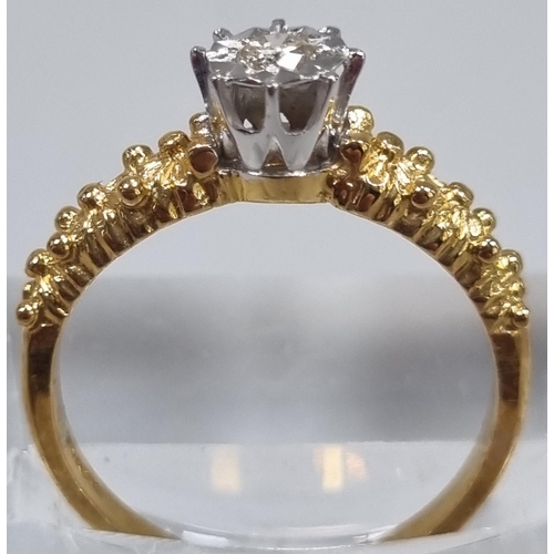 166 - 18ct gold diamond solitaire illusion set ring with moulded floral designs to each shoulder. 3g appro... 