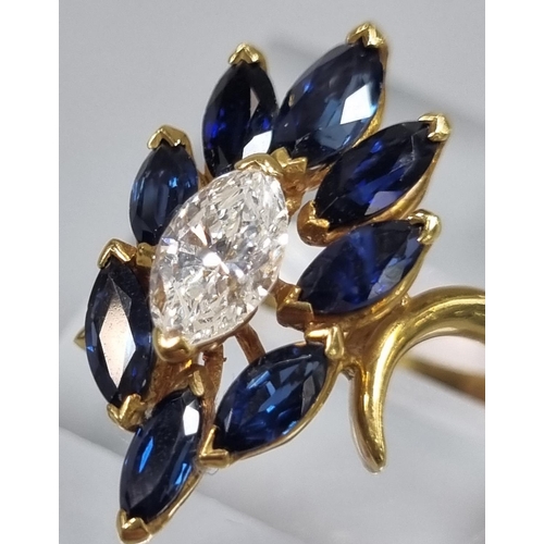 167 - 18ct gold oval cut diamond and eight stone tanzanite flowerhead ring. 5.2g approx. Ring size K.
(B.P... 