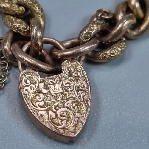 181 - Victorian 9ct gold curb link bracelet with engraved heart shaped locket. 19.6g approx. 
(B.P. 21% + ... 