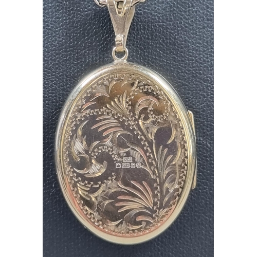 184 - 9ct gold chain with a 9ct gold engraved floral locket. Total weight 15.6g approx. Chain length 41cm ... 