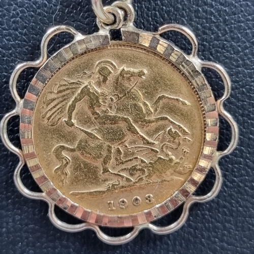 188 - 9ct gold chain with gold half sovereign pendant in 9ct gold mount, dated 1903. 11.3g approx.
(B.P. 2... 