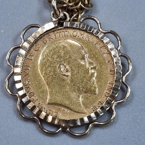 188 - 9ct gold chain with gold half sovereign pendant in 9ct gold mount, dated 1903. 11.3g approx.
(B.P. 2... 