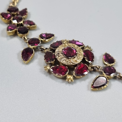 193 - 19th Century 18ct gold curb link necklace pendant set with a cluster of floral stones, probably garn... 