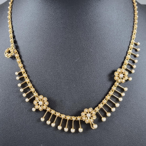 194 - Late 19th/early 20th Century yellow metal pearl fringe necklace, suspending a graduated fringe of fo... 