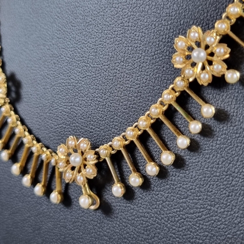 194 - Late 19th/early 20th Century yellow metal pearl fringe necklace, suspending a graduated fringe of fo... 