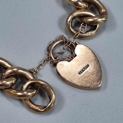 197 - Victorian 9ct curb link engraved bracelet with heart shaped padlock. 22g approx.
(B.P. 21% + VAT)