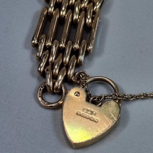 201 - 9ct gold five bar gate bracelet with heart shaped padlock. 20g approx. 
(B.P. 21% + VAT)