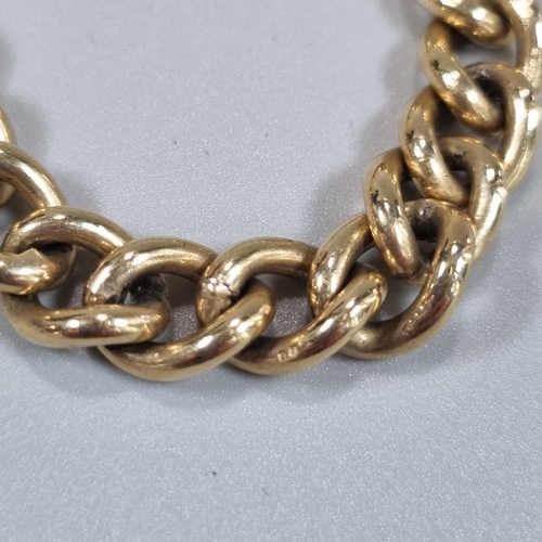 202 - 9ct gold curb link bracelet with heart shaped padlock. 35.2g approx. 
(B.P. 21% + VAT)