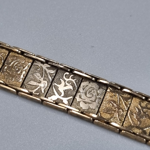 207 - 9ct gold ladies multi link bracelet, each panel decorated with roses, foliage etc. 19cm long, 16.7g ... 