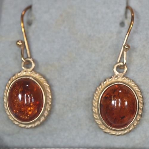 215 - Pair of 9ct gold and green hardstone cabochon earrings, together with a pair of 9ct gold and amber c... 