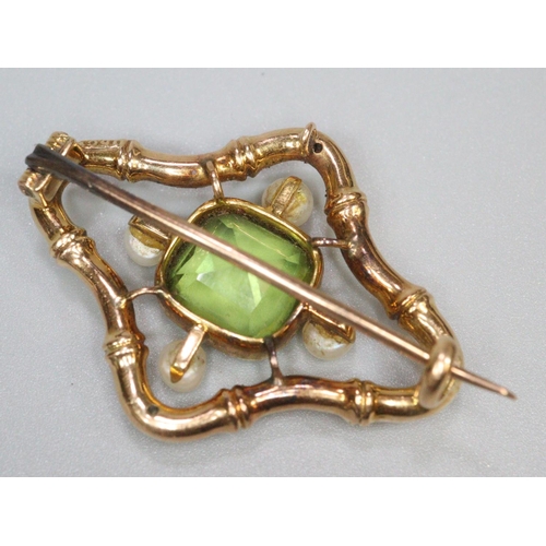 217 - Edwardian 15ct gold pearl and peridot brooch. 3.1 x 2.3cm approx. 4.8g approx.
(B.P. 21% + VAT)