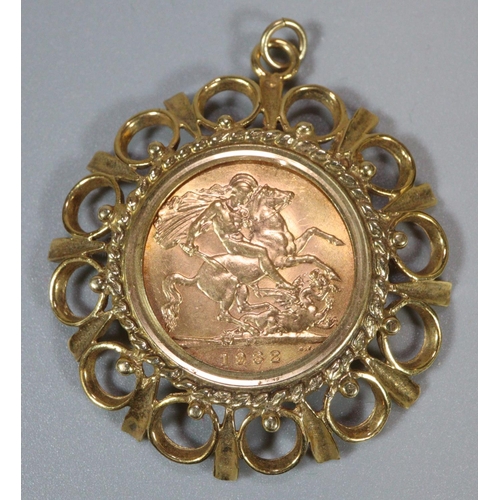 238 - George V gold full sovereign inset in ornate 9ct gold pendant mount, the sovereign dated 1932. 13g a... 