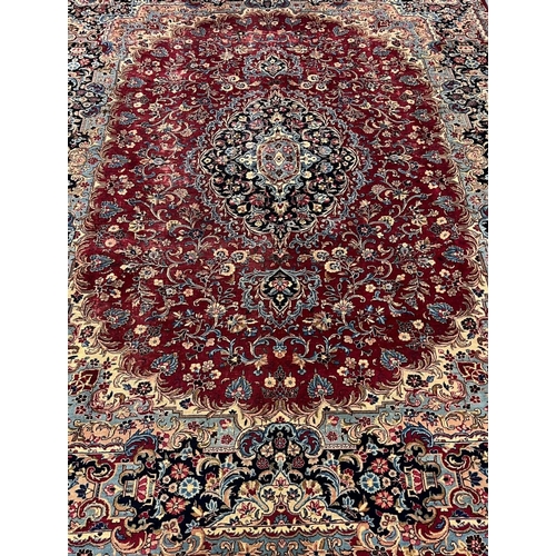 301 - Large rich red ground Persian Kashmar floral and foliate carpet. 305 x 400cm approx.
(B.P. 21% + VAT... 