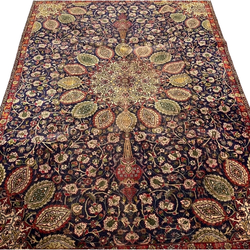 304 - Vintage blue ground Persian Tabriz carpet, having Shah Safi designs. 330 x 232cm approx.
(B.P. 21% +... 