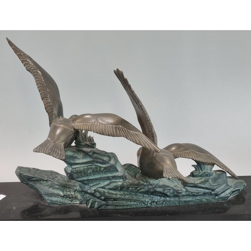 75 - Art Deco design spelter figure group of two gulls with outstretched wings on a rocky outcrop above a... 