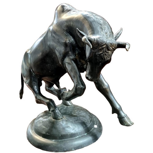 82 - Large and impressive bronze sculpture of a charging bull , on circular naturalistic base. Unsigned. ... 