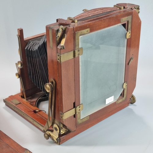 85 - A Beck mahogany brass mounted folding plate camera with 'Beck' symmetrical lens. 6 x 5