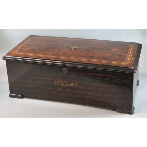 87 - 19th Century Swiss musical box, having inlaid and ebonised case with hinged cover revealing cylinder... 