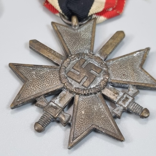 94 - German 2nd World War Iron Cross First Class, a Kriegsmarine High Seas Breast badge, a   Nazi Merit C... 