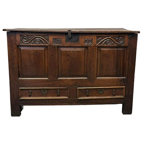 58 - 18th Century oak coffer, the moulded and iron hinged top with fitted candle box above an iron lock w... 
