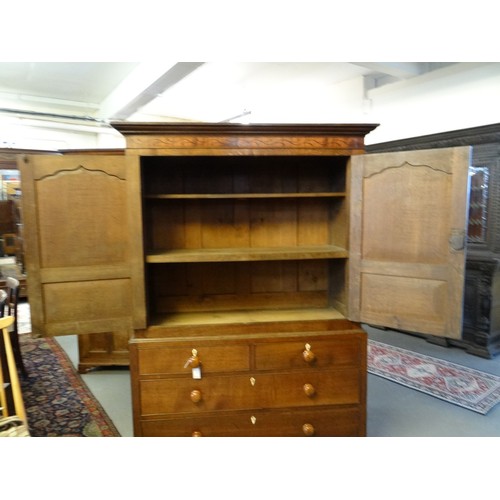 10 - 19th Century Welsh oak two stage press cupboard, having moulded cornice over seaweed inlaid frieze, ... 