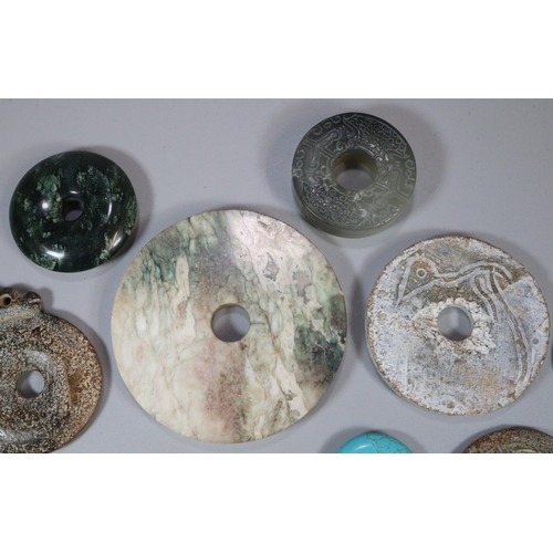 143 - A collection of unusual Chinese 'Bi' discs to include varying designs and hardstones including; mala... 
