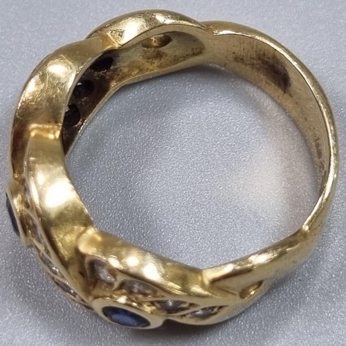 176 - Yellow metal probably 18ct gold diamond and sapphire twist design ring, having twenty four small dia... 