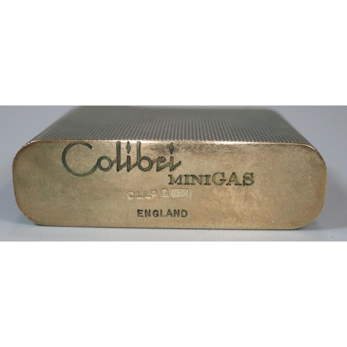 248 - Vintage 9ct gold Colibri Minigas engine turned lighter. 65.7g approx. 
(B.P. 21% + VAT)