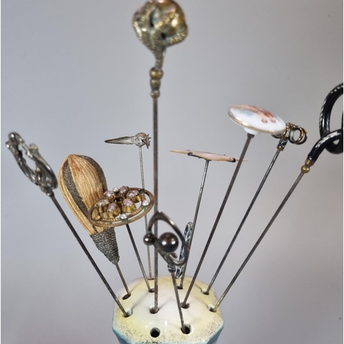 259 - An extensive collection of early 20th century/Art Nouveau and other hatpins, many contained in ceram... 