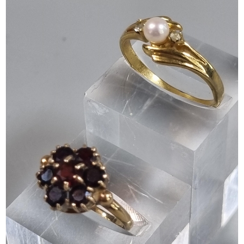 242 - 9ct gold garnet cluster flower head ring. 2.9g approx.  Ring Size M.  Together with a dress ring.  (... 