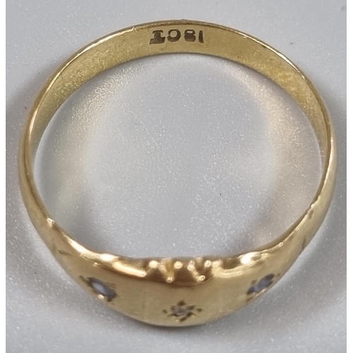 205 - 18ct gold ring inset with three tiny diamond chips.  2.3g approx.  Size O.   (B.P. 21% + VAT)