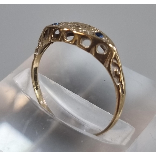 231 - 9ct gold and sapphire ring with small diamond chip.  0.8g approx.  Size K.  (B.P. 21% + VAT)