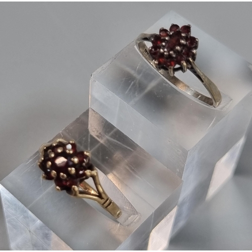 236 - 9ct gold and garnet cluster ring.  1.6g approx.  Size O.  Together with another cluster ring with in... 