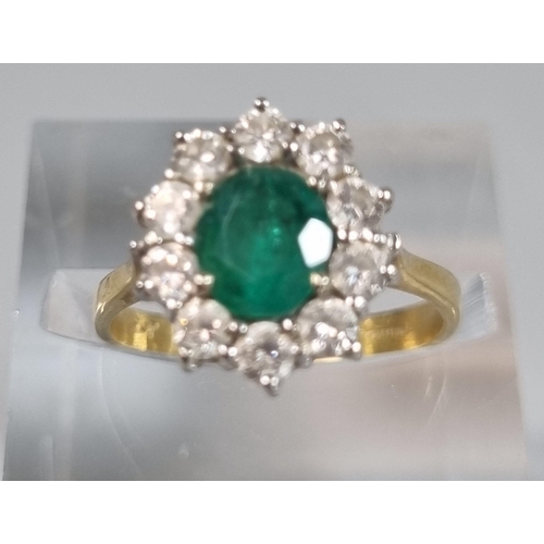 241 - 18ct gold flower head ring with ten diamonds and central emerald stone.  3.2g approx.  Size J.  (B.P... 