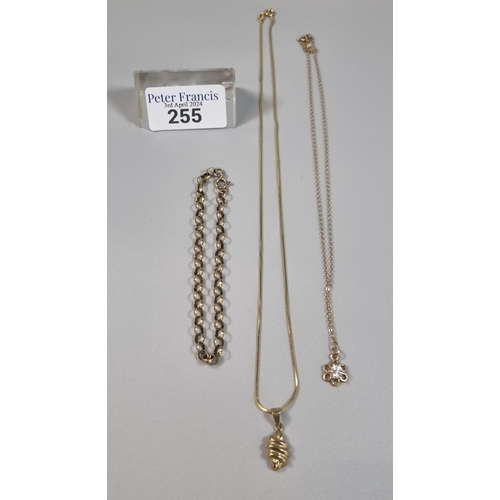 255 - 9ct gold fine link chain with abstract pendant together with a 9ct gold curb link bracelet and anoth... 