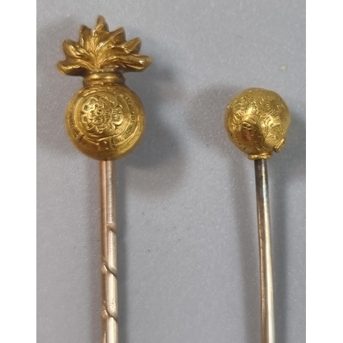 256 - 18ct gold Royal Welch Fusiliers stock pin together with another 15ct gold stock pin with ball mount.... 