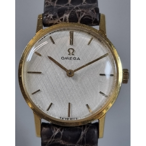 269 - Omega 9ct gold ladies wristwatch, having satin face with baton numerals and leather strap.  Weight o... 