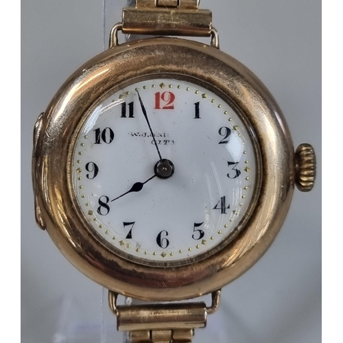 270 - Vintage 9ct gold cushion shaped circular wristwatch with Arabic numerals to the enamel face on expan... 